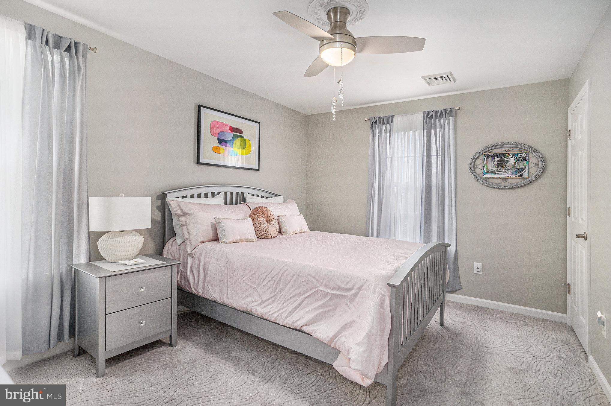 472 Evansburg Road Collegeville, PA 19426 - Photo 33 of 48 a bedroom with a bed and a chandelier