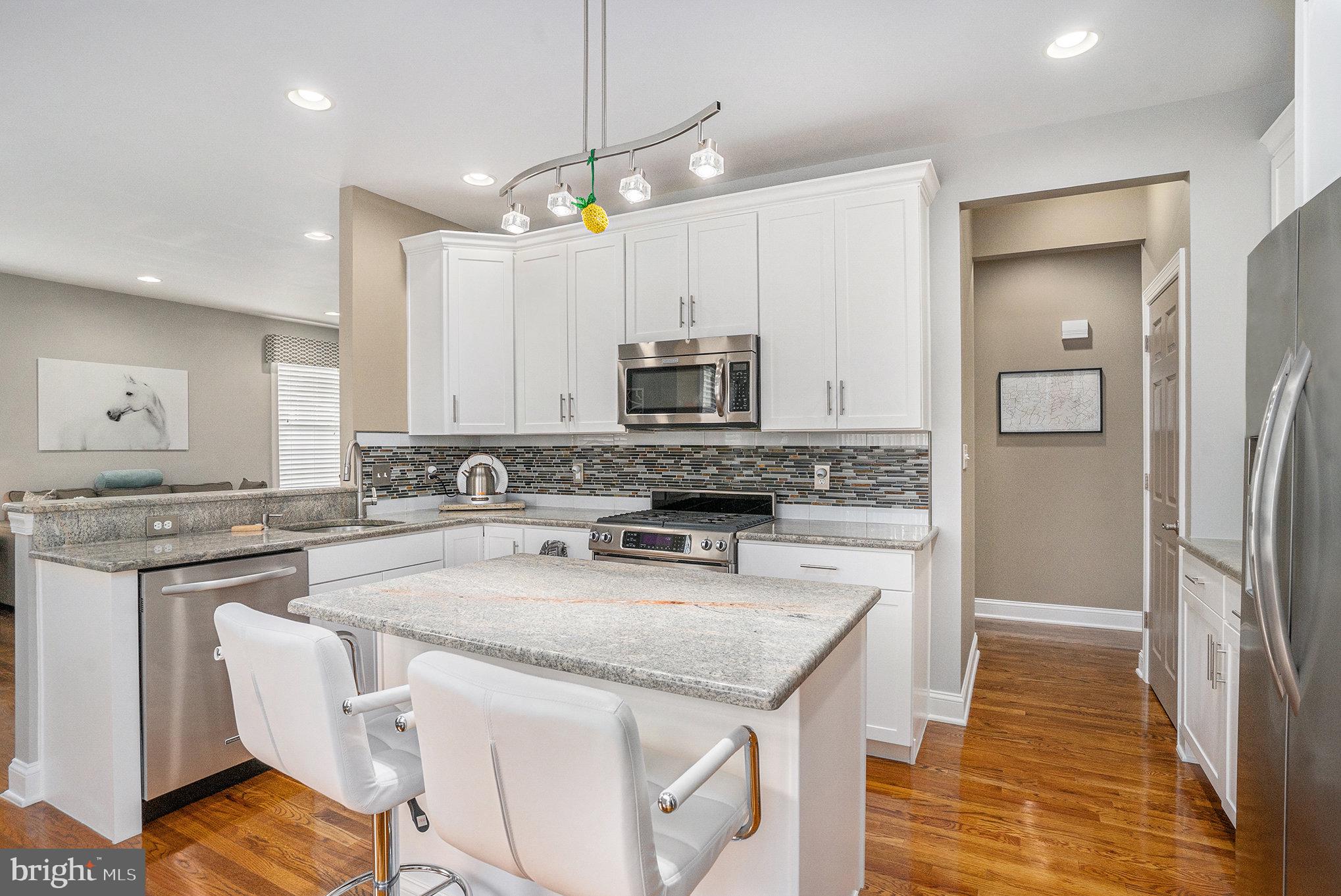 472 Evansburg Road Collegeville, PA 19426 - Photo 9 of 48 a kitchen with stainless steel appliances granite countertop a stove a sink a refrigerator and a microwave