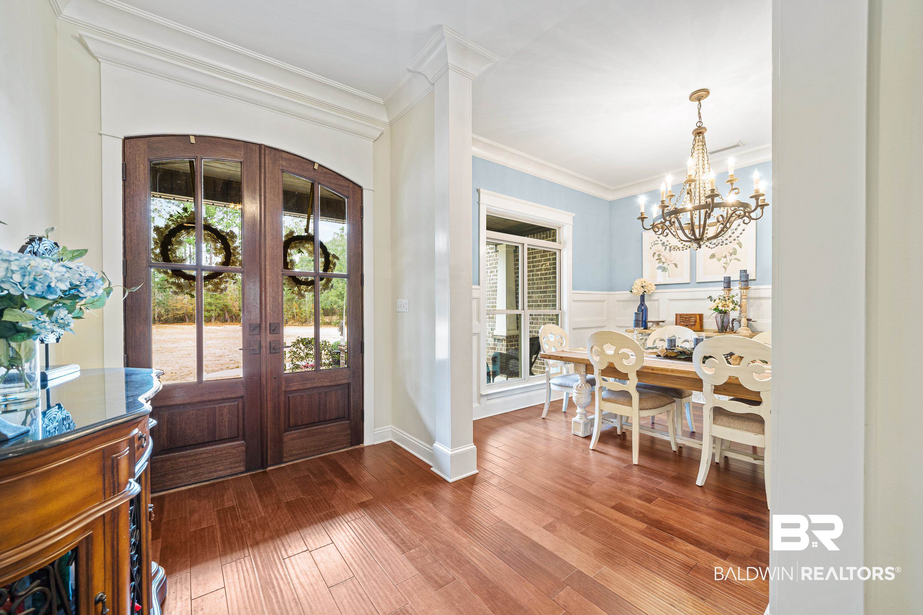 36784 Legacy Way Bay Minette, AL 36507 - Photo 8 of 57 Foyer with ornamental molding, wood-type flooring, an inviting chandelier, and french doors