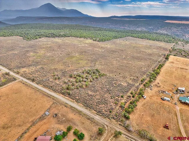 a view of an ocean beach and mountain