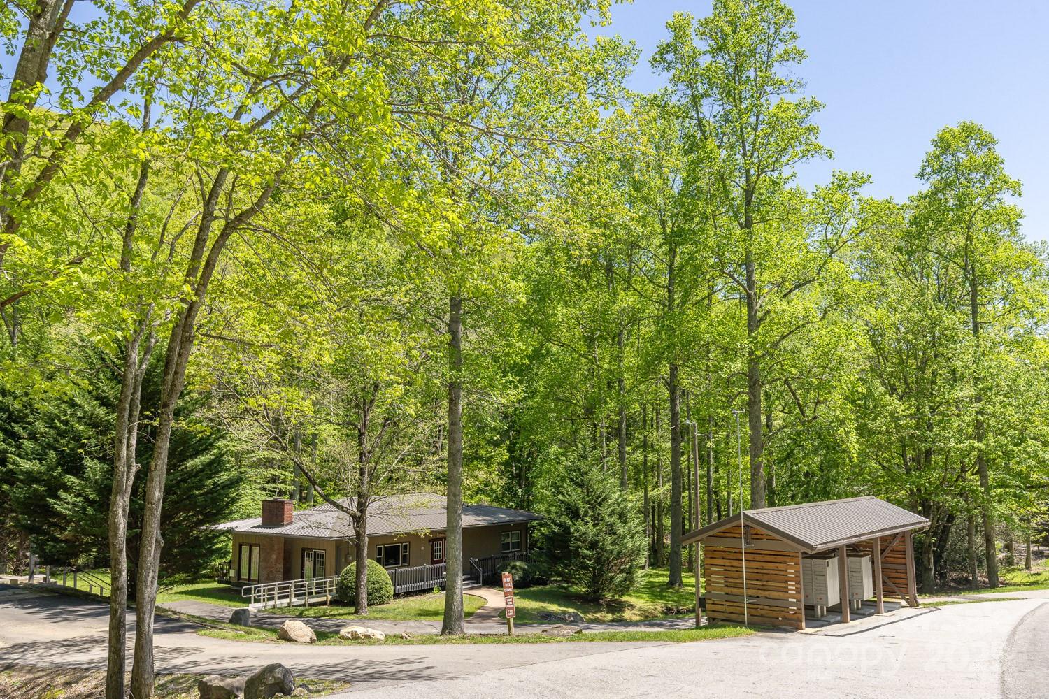 89 Weeping Cherry Forest Road Fairview, NC 28730 - Photo 12 of 15 a front view of a house with a yard
