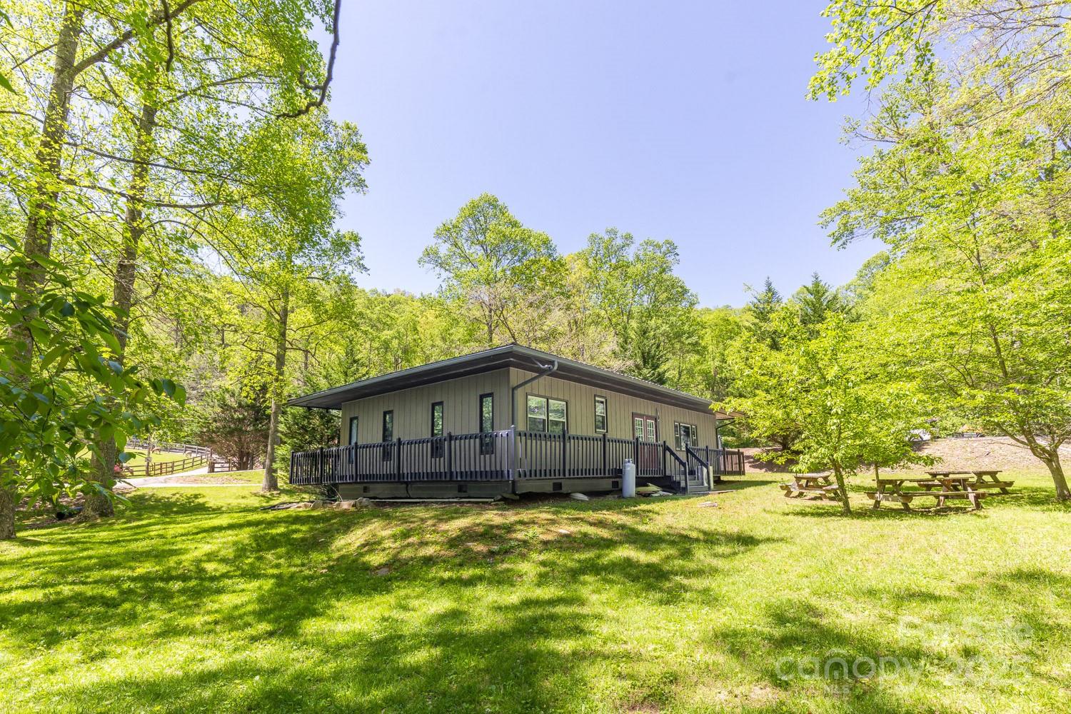 89 Weeping Cherry Forest Road Fairview, NC 28730 - Photo 7 of 15 a house view with a swimming pool