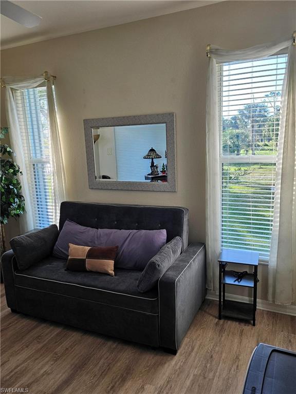 7791 Grande Pine Road Bokeelia, FL 33922 - Photo 31 of 45 a living room with furniture and a window