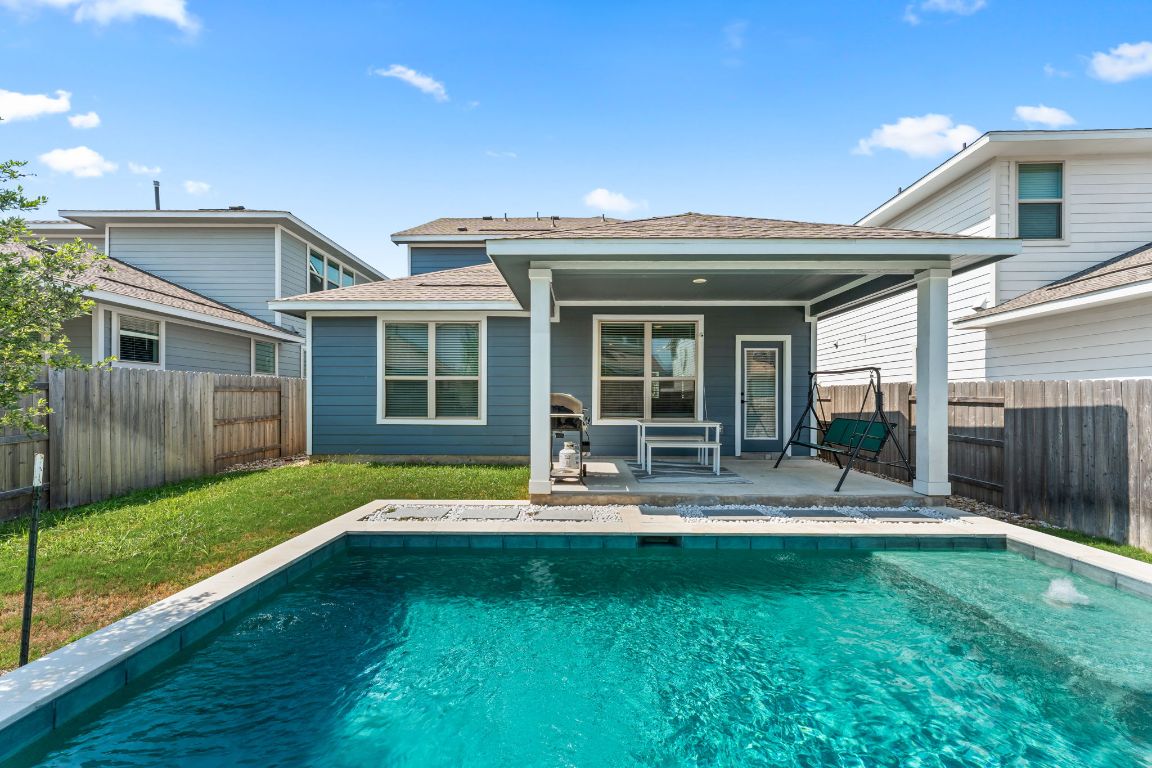 8512 McKamy Drive Austin, TX 78744 - Photo 1 of 28 A resort-style pool makes this home an entertainer’s dream.