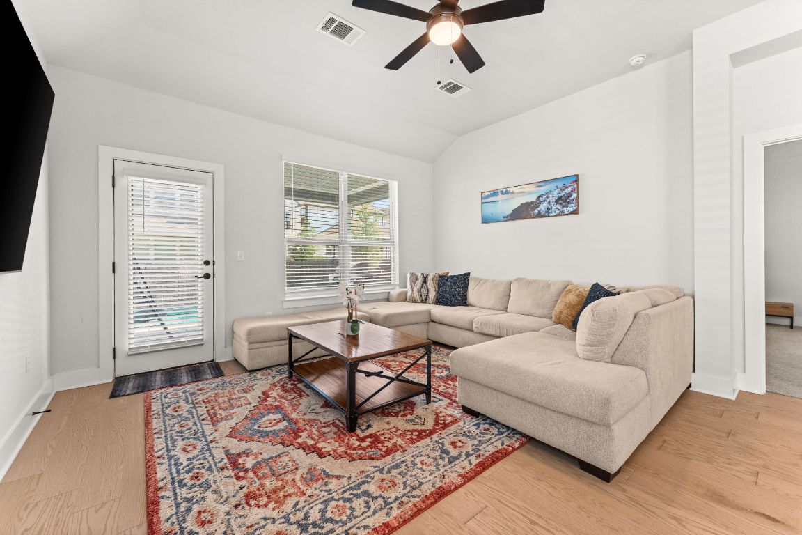 8512 McKamy Drive Austin, TX 78744 - Photo 12 of 28 High ceilings and large windows create a bright, airy atmosphere.