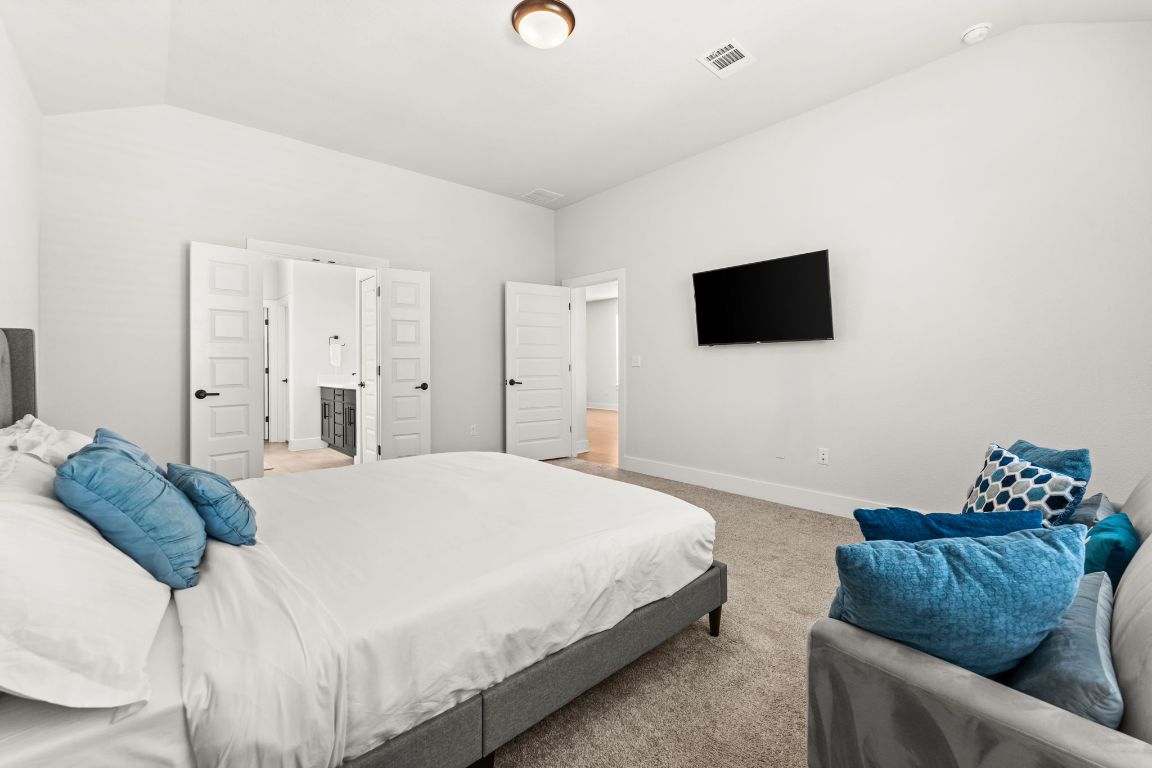 8512 McKamy Drive Austin, TX 78744 - Photo 14 of 28 A large walk-in closet provides ample storage and organization.