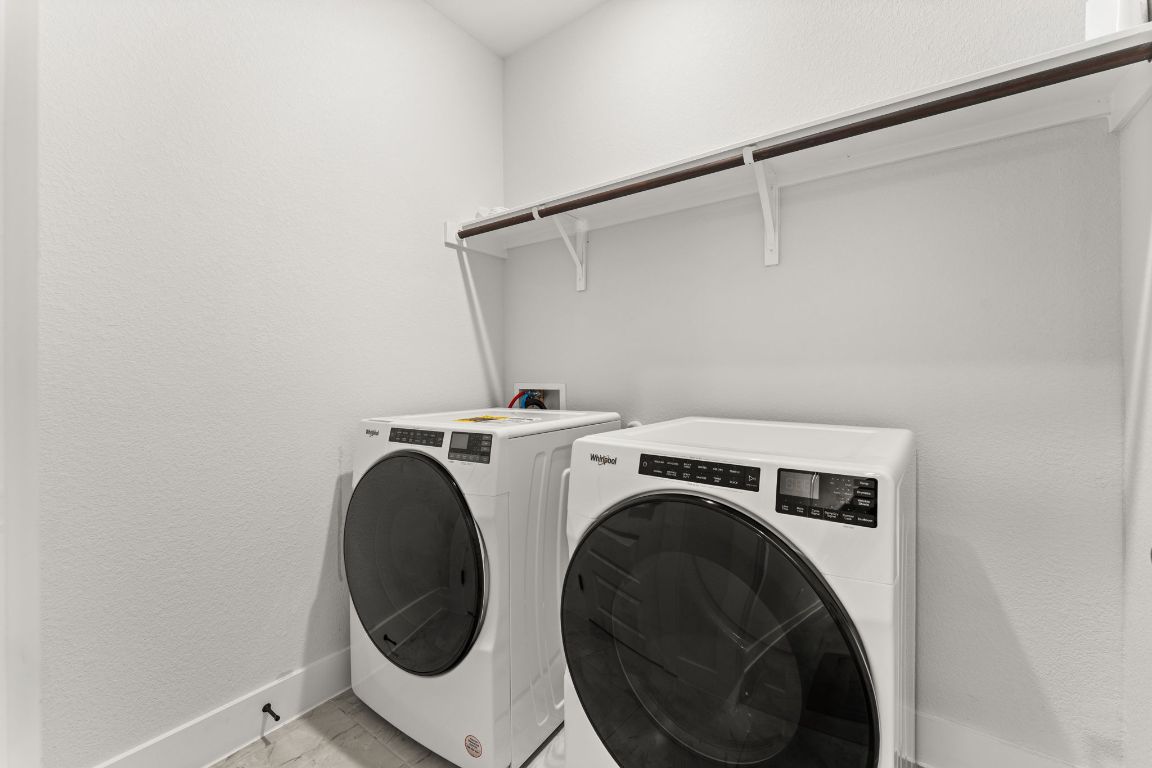 8512 McKamy Drive Austin, TX 78744 - Photo 18 of 28 A dedicated laundry room provides extra storage and everyday convenience.