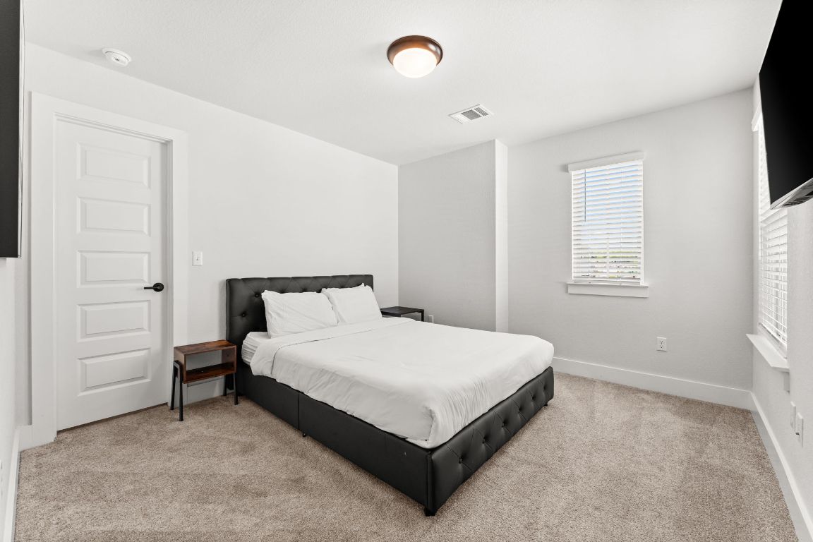 8512 McKamy Drive Austin, TX 78744 - Photo 20 of 28 Three additional bedrooms provide comfort for family or guests.