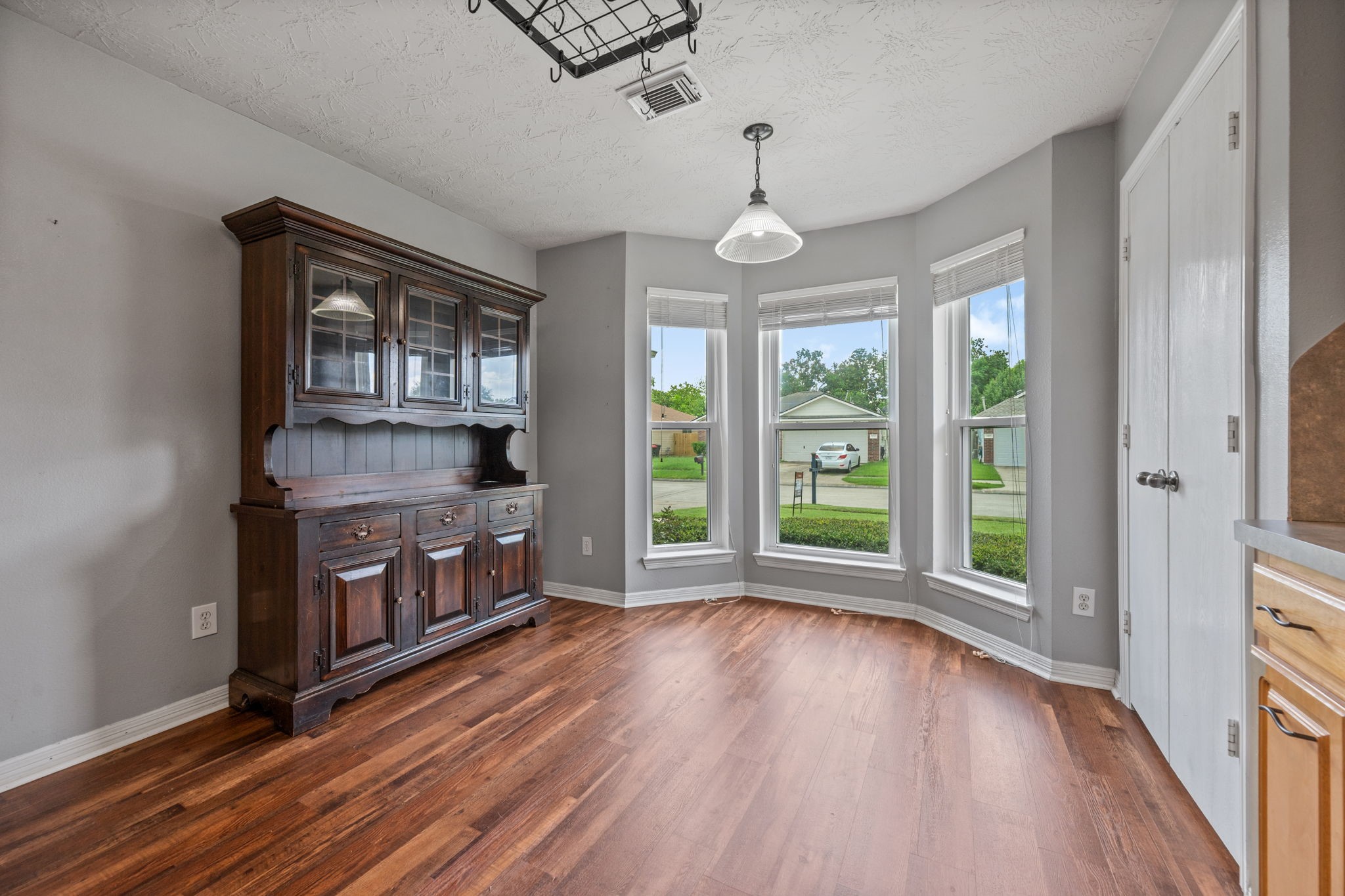 3330 Red Cedar Drive Baytown, TX 77521 - Photo 13 of 25 a view of wooden floor fire place and windows in a room