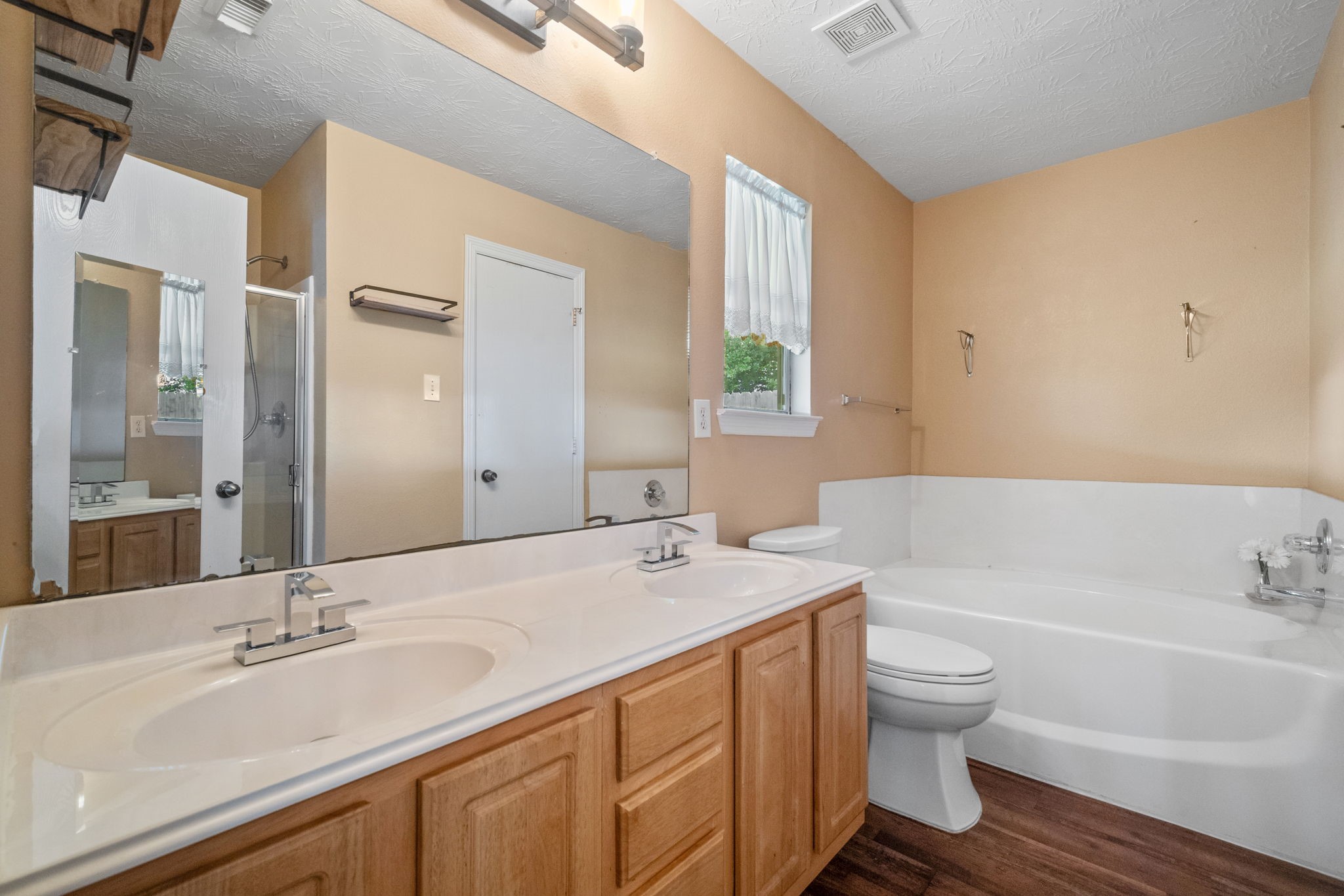 3330 Red Cedar Drive Baytown, TX 77521 - Photo 16 of 25 a bathroom with a sink and a mirror