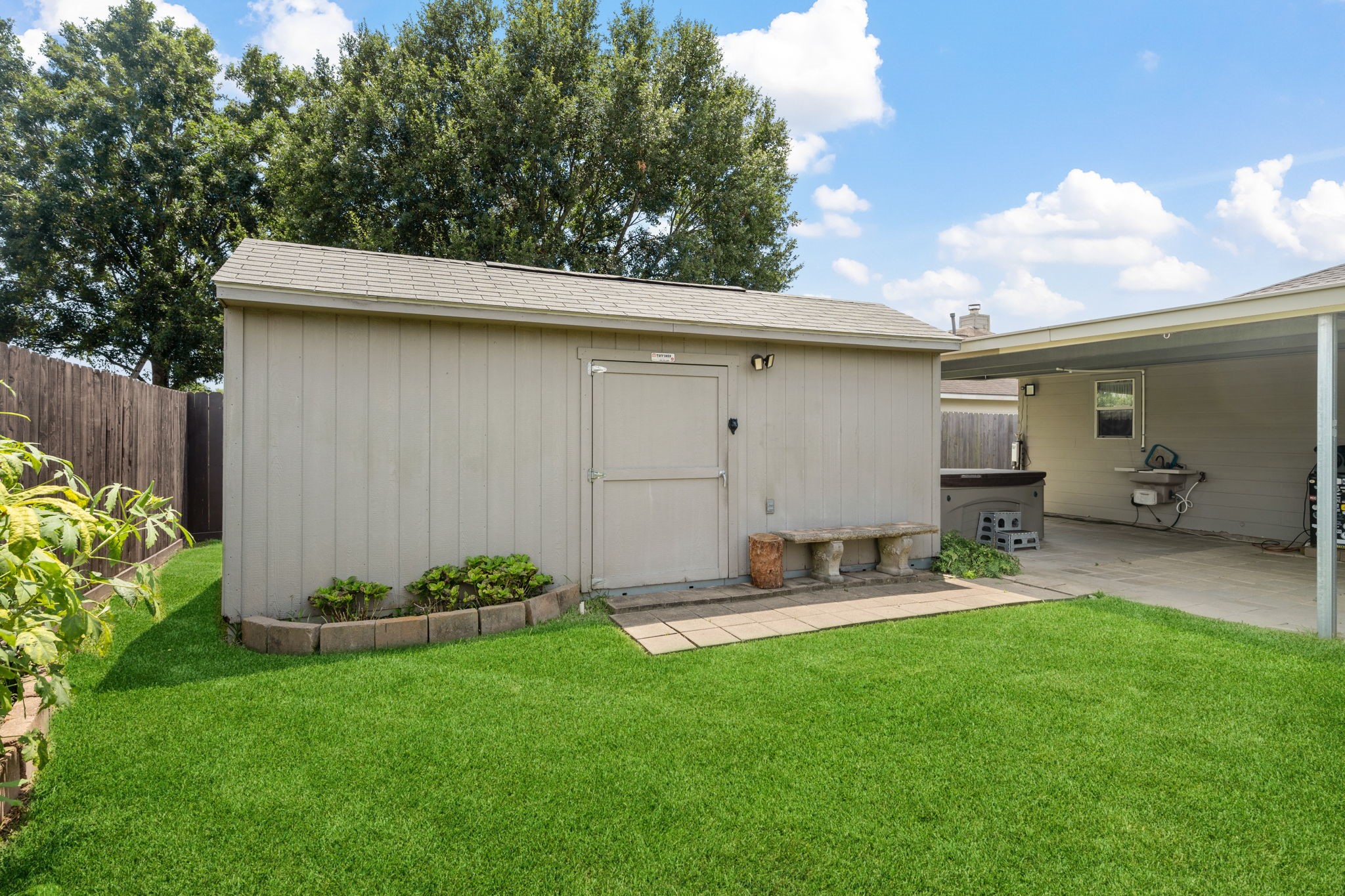 3330 Red Cedar Drive Baytown, TX 77521 - Photo 25 of 25 a view of a backyard with couches plants and large trees