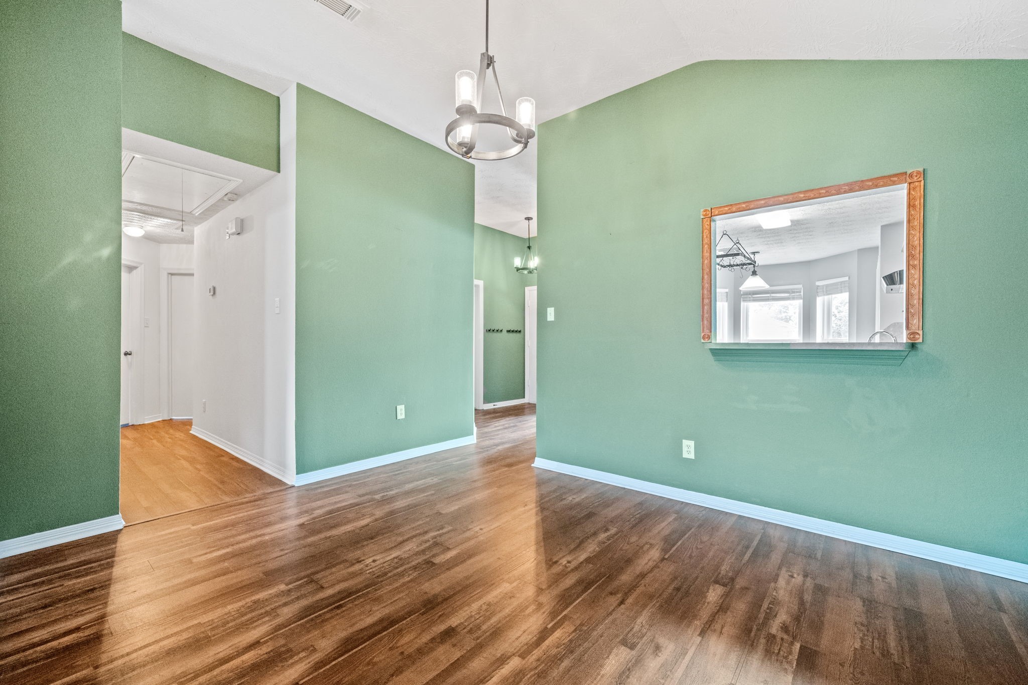 3330 Red Cedar Drive Baytown, TX 77521 - Photo 4 of 25 a view of a room with wooden floor and windows