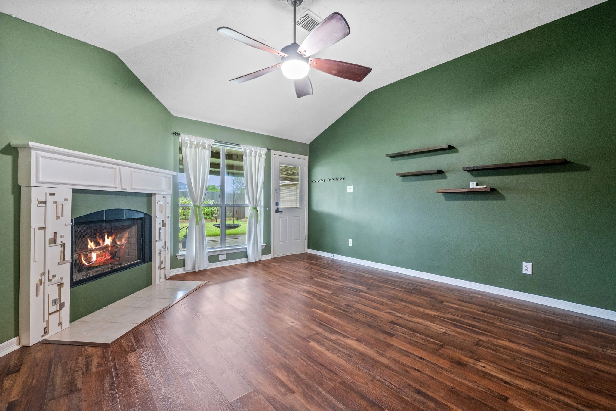 3330 Red Cedar Drive Baytown, TX 77521 - Photo 6 of 25 a view of an empty room with a fireplace and a fireplace