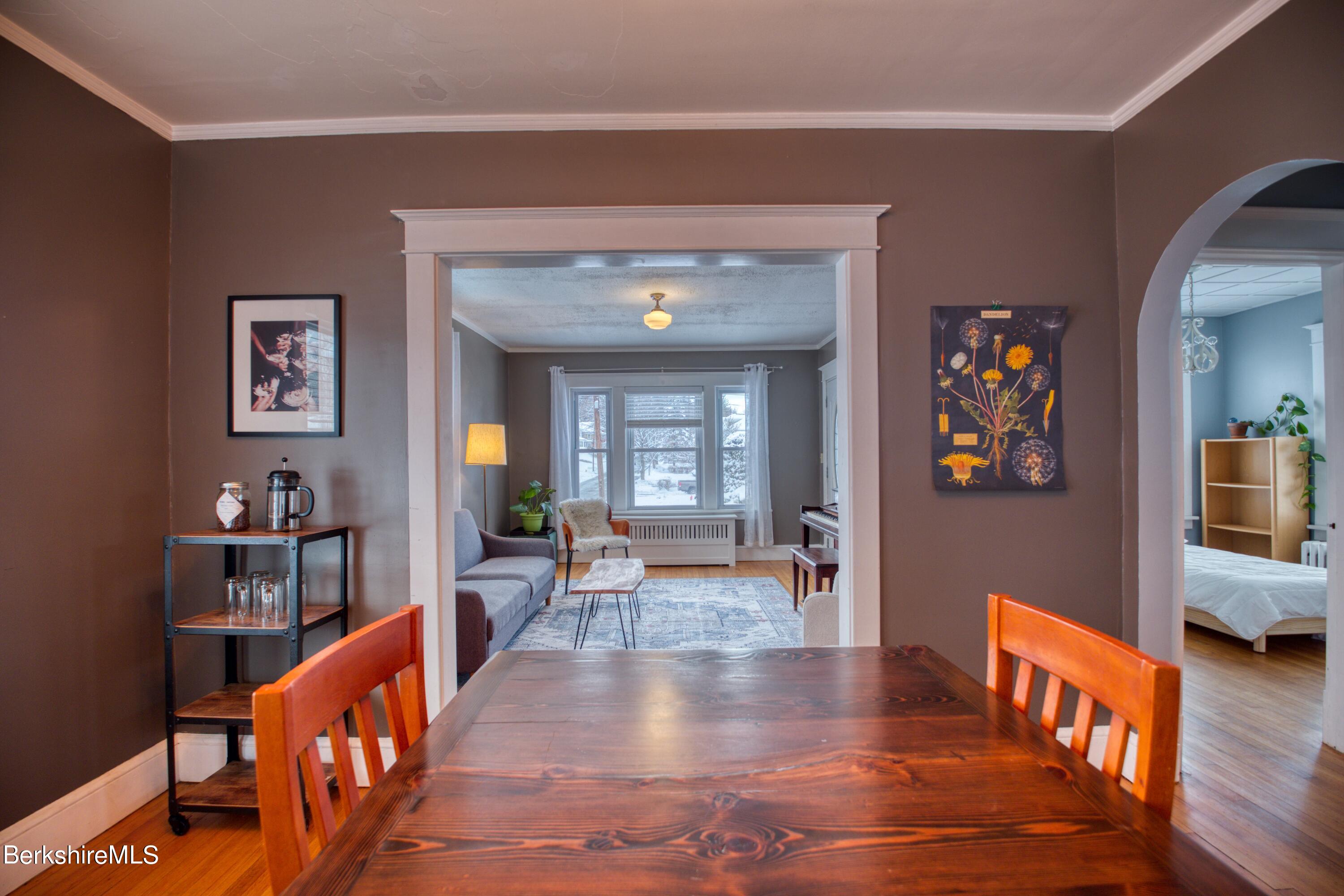 39 Catherine Street Pittsfield, MA 01201 - Photo 11 of 26 a large living room with stainless steel appliances lots of furniture and rug