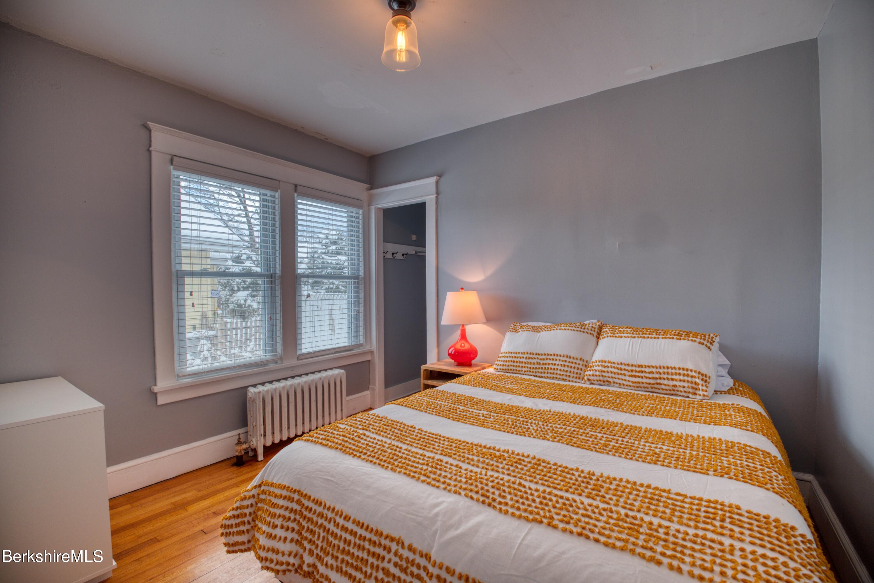 39 Catherine Street Pittsfield, MA 01201 - Photo 12 of 26 a bedroom with a bed and a window