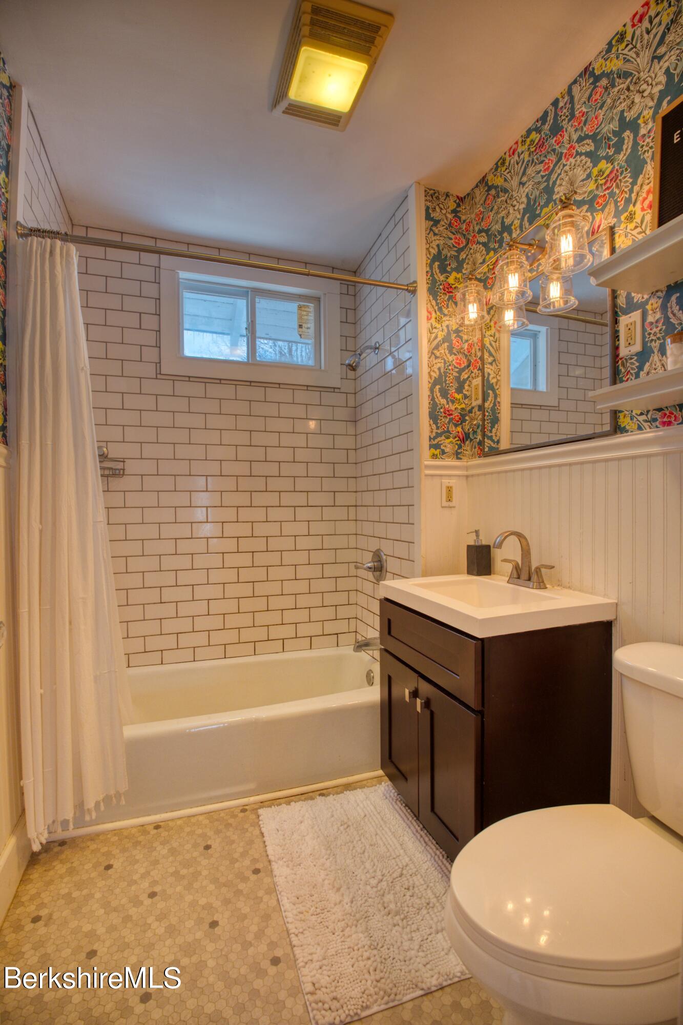 39 Catherine Street Pittsfield, MA 01201 - Photo 14 of 26 a bathroom with a sink a toilet and shower