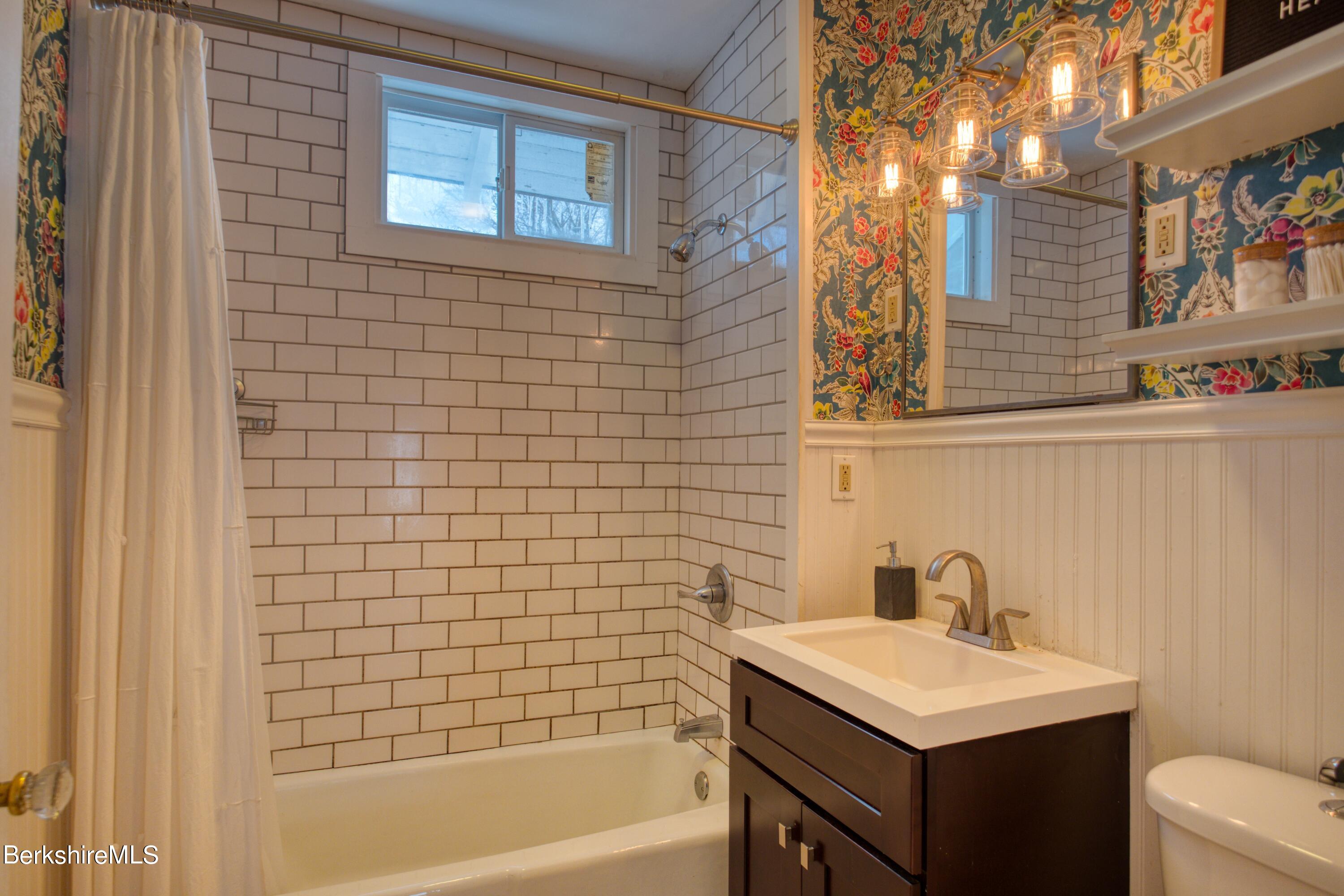 39 Catherine Street Pittsfield, MA 01201 - Photo 15 of 26 a bathroom with a sink a toilet and shower