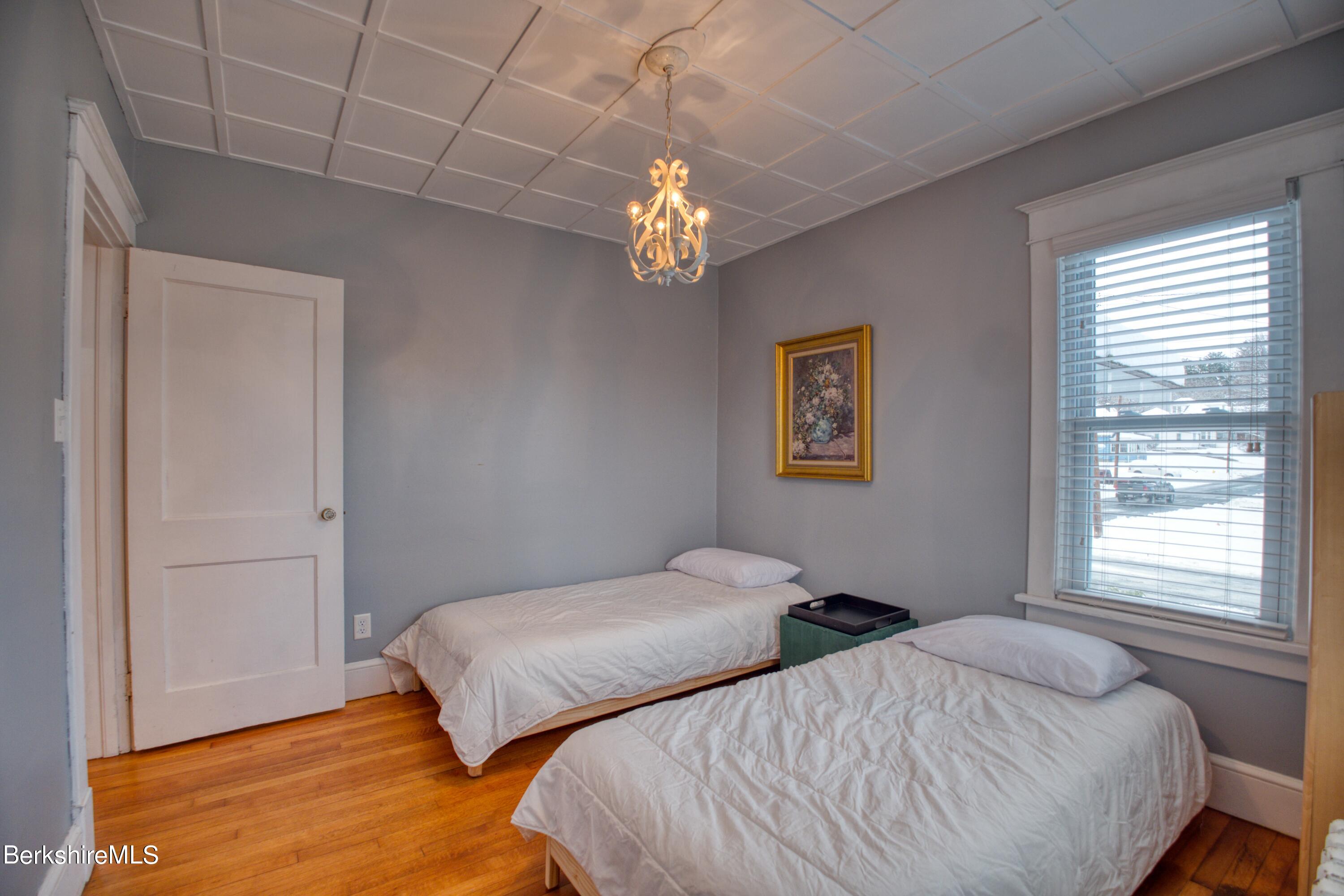 39 Catherine Street Pittsfield, MA 01201 - Photo 17 of 26 a bedroom with two beds and a window