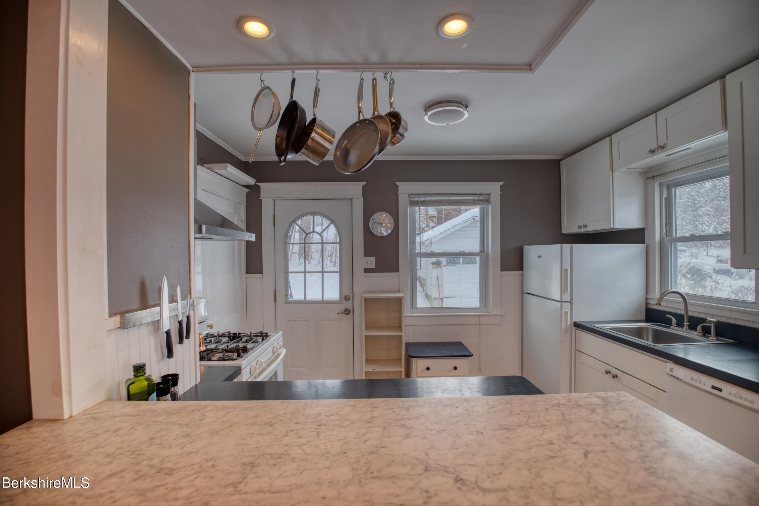 39 Catherine Street Pittsfield, MA 01201 - Photo 21 of 26 a view of a kitchen with sink and natural light