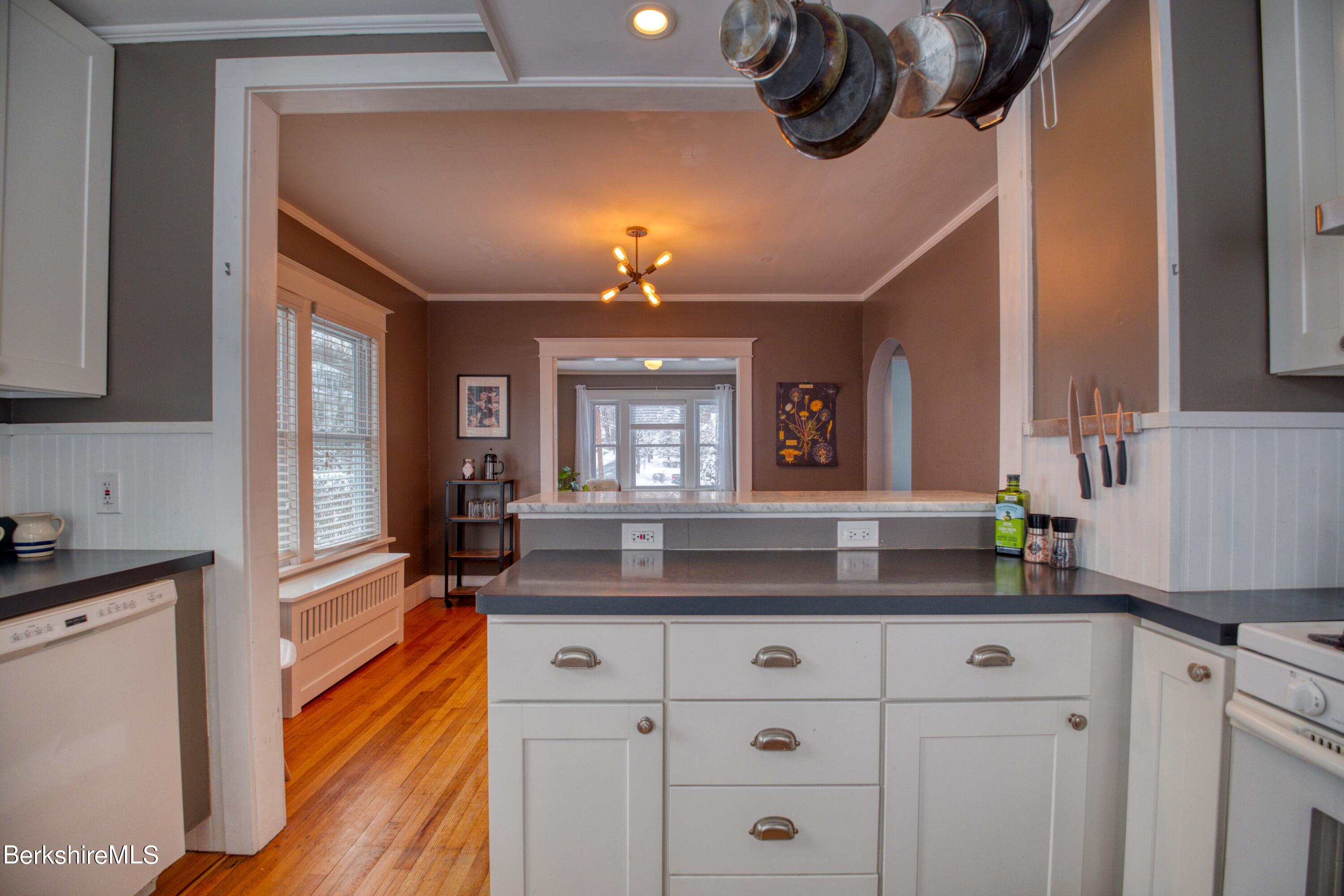 39 Catherine Street Pittsfield, MA 01201 - Photo 24 of 26 a kitchen with cabinets and window