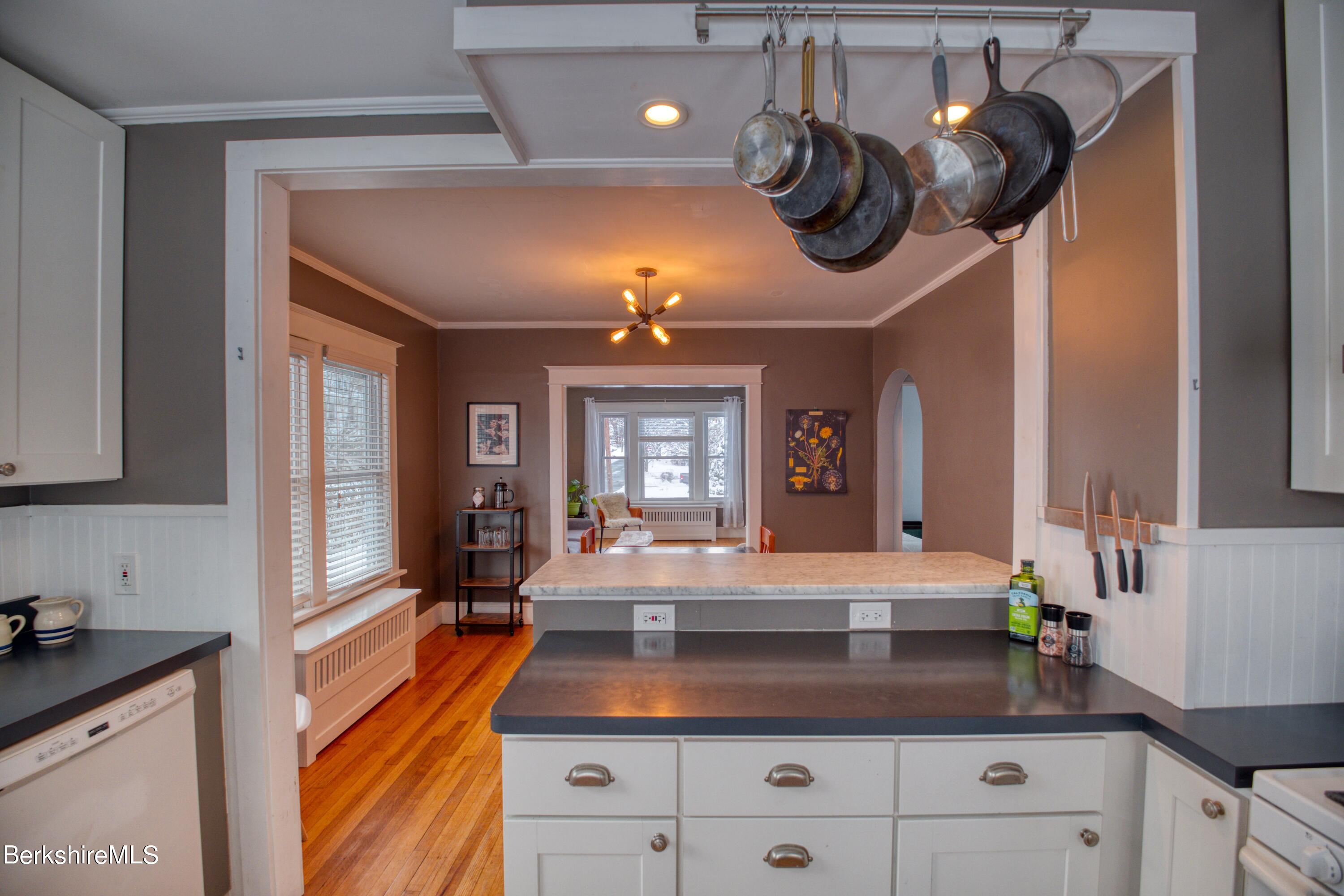 39 Catherine Street Pittsfield, MA 01201 - Photo 25 of 26 a view of living room with granite countertop furniture and chandelier