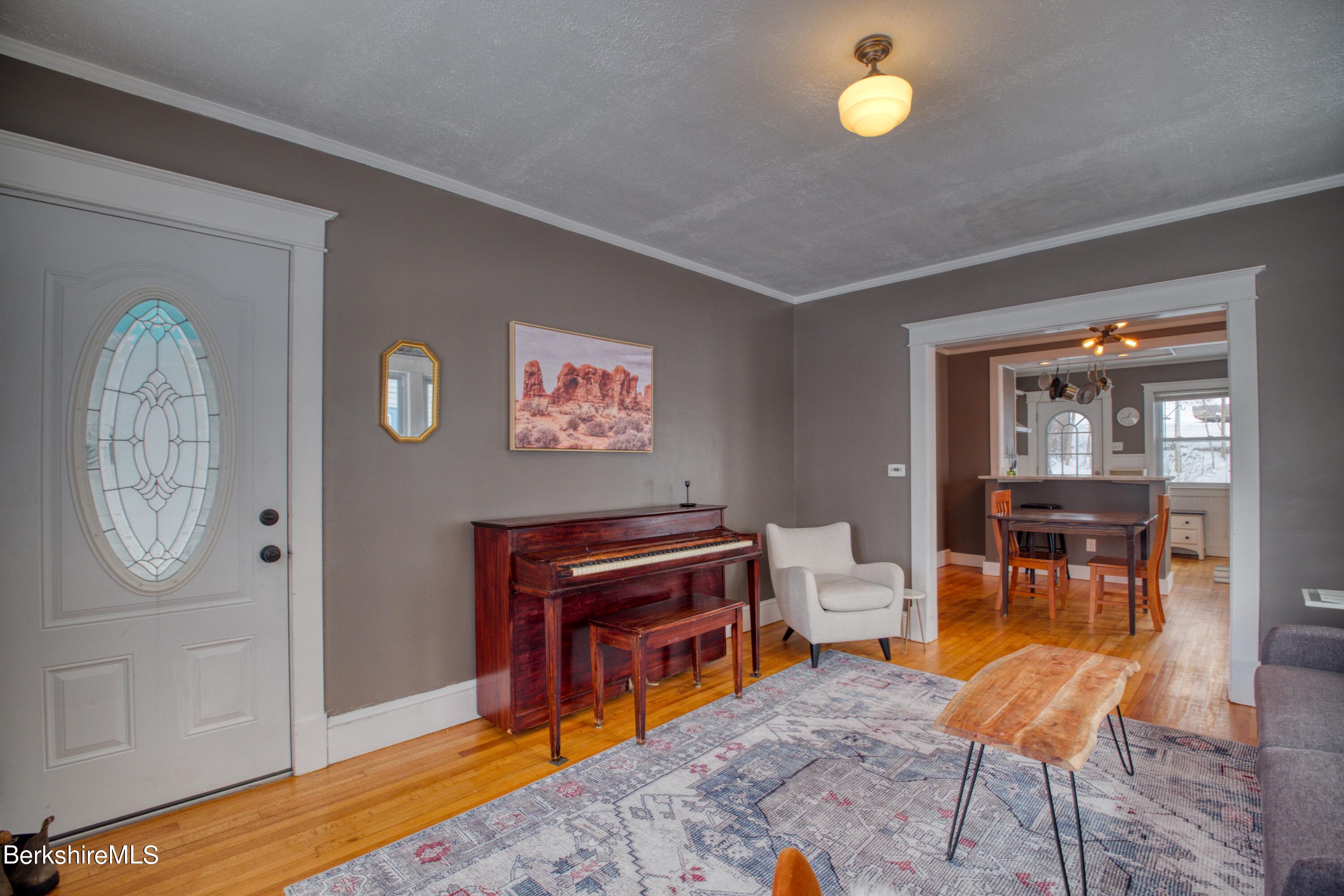 39 Catherine Street Pittsfield, MA 01201 - Photo 6 of 26 a view of a livingroom with furniture and a chandelier