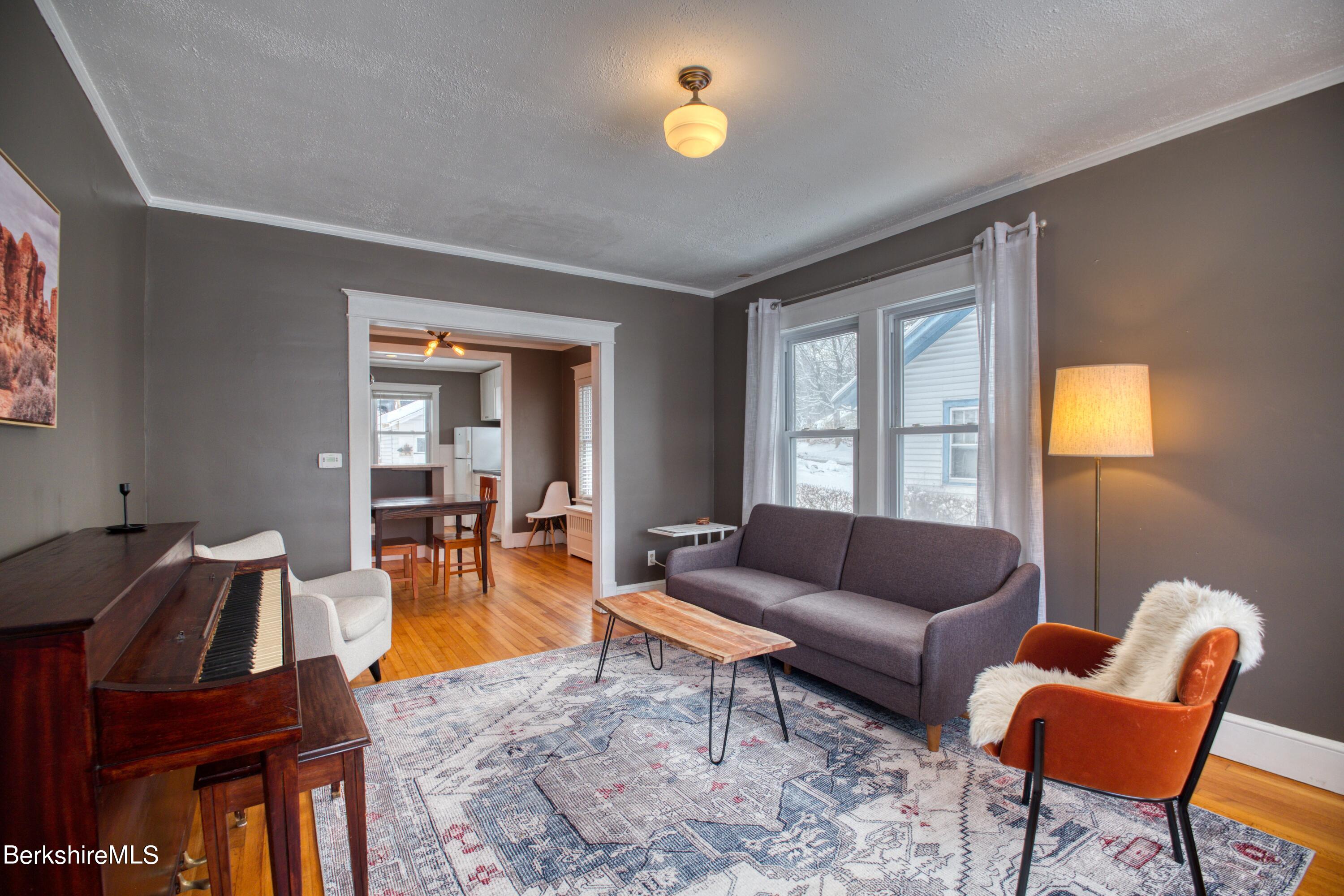 39 Catherine Street Pittsfield, MA 01201 - Photo 7 of 26 a living room with furniture and a window