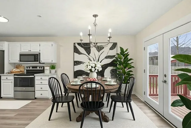 a view of a dining room with furniture and wooden floor