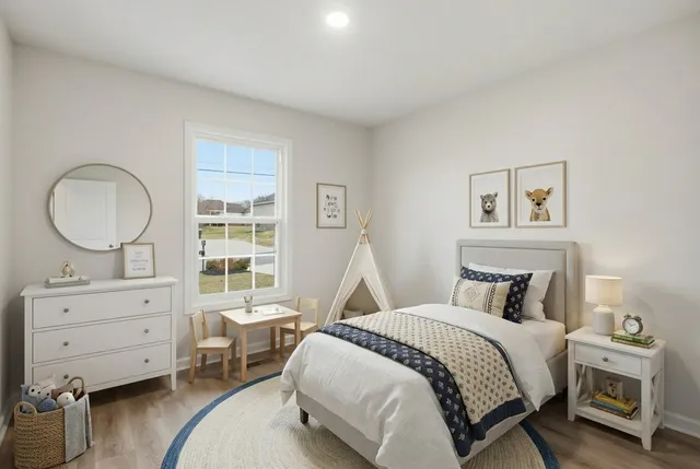 a bedroom with a bed and a dresser