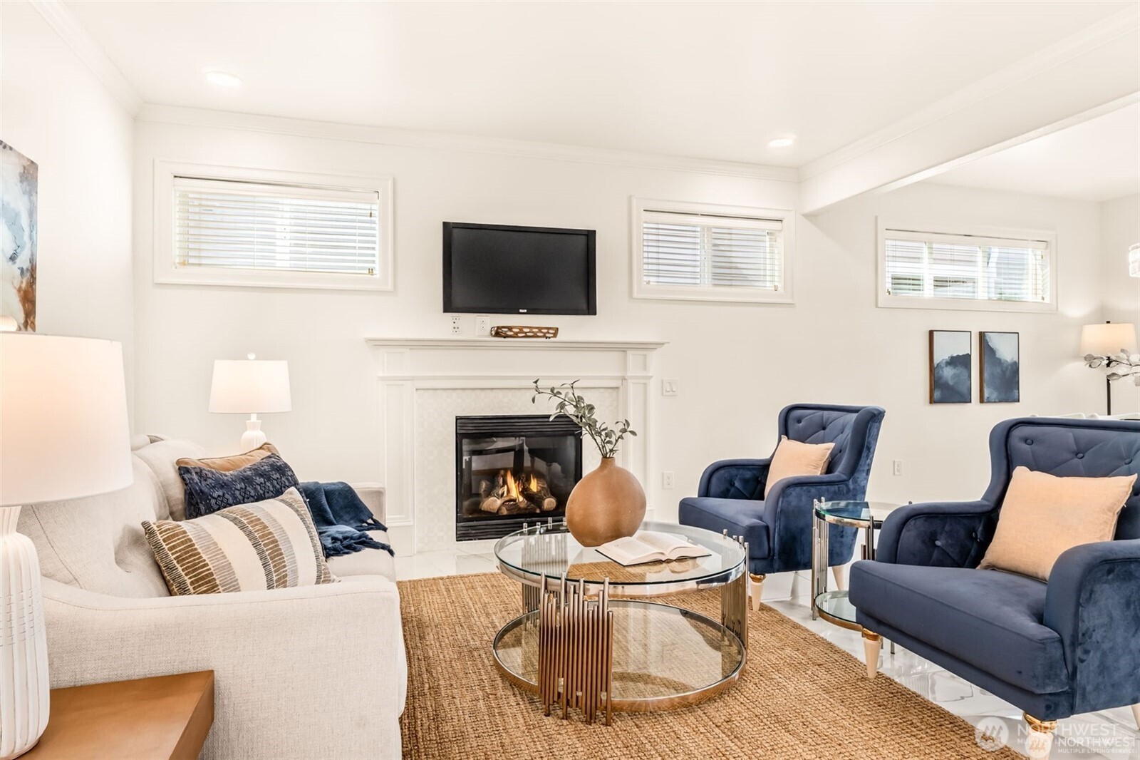 3631 214th Place Southeast Bothell, WA 98021 - Photo 12 of 38 a living room with furniture a flat screen tv and a fireplace