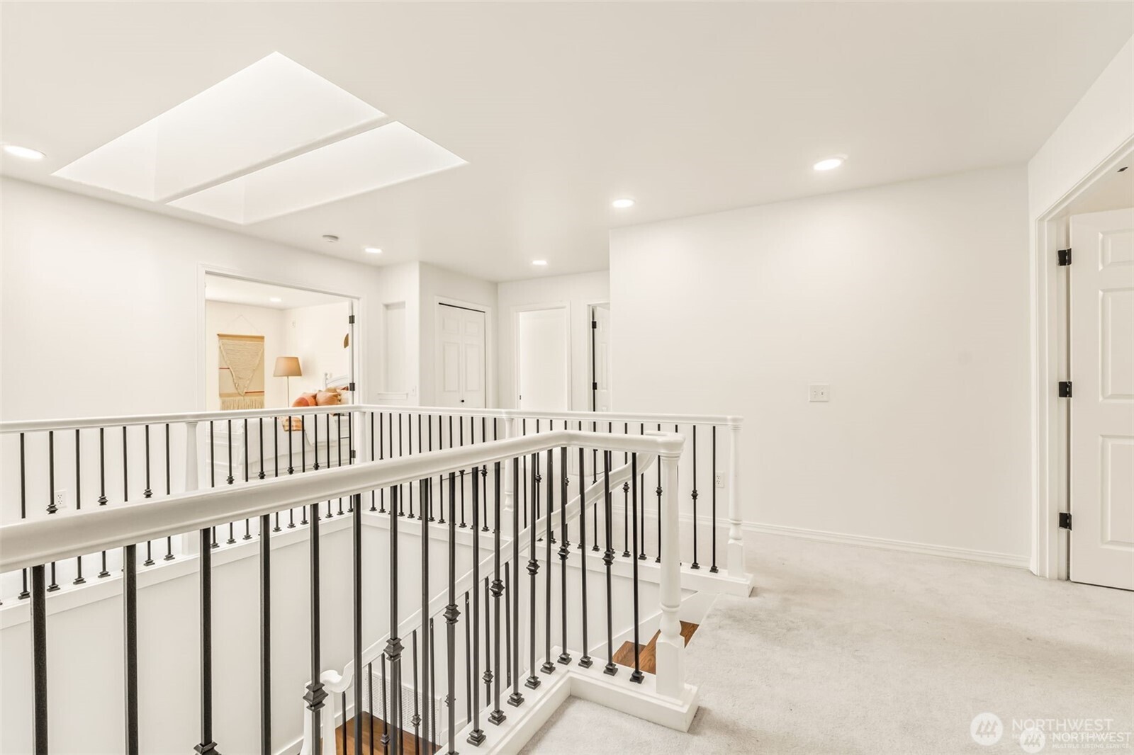 3631 214th Place Southeast Bothell, WA 98021 - Photo 18 of 38 a view of a hallway with wooden floor and staircase