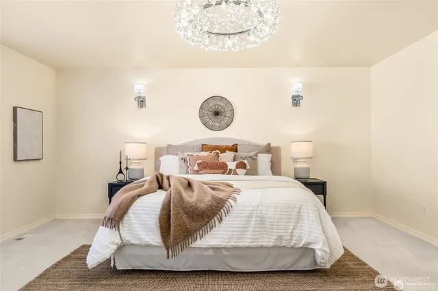 a bedroom with a bed and a fireplace