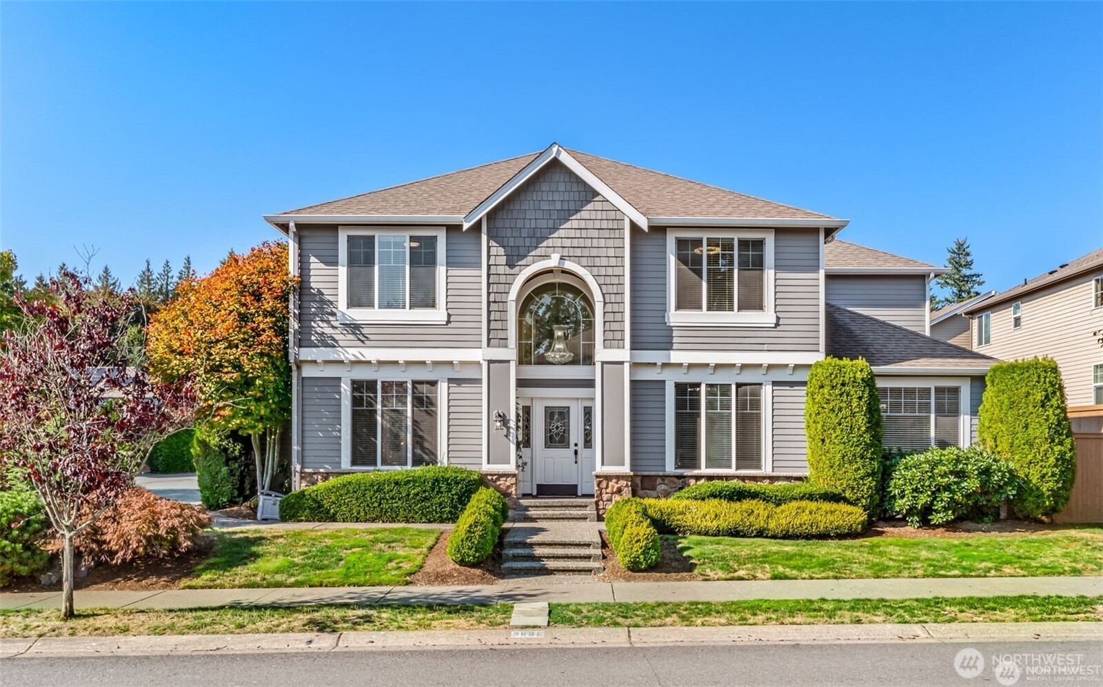 3631 214th Place Southeast Bothell, WA 98021 - Photo 2 of 38 a front view of a house with a yard