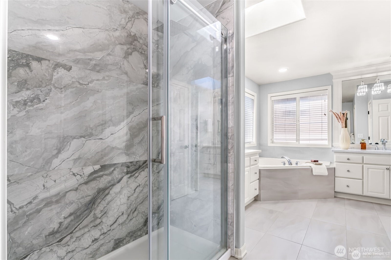 3631 214th Place Southeast Bothell, WA 98021 - Photo 23 of 38 a bathroom with a bathtub sink shower and mirror