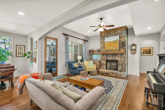 a living room with furniture fireplace and flat screen tv
