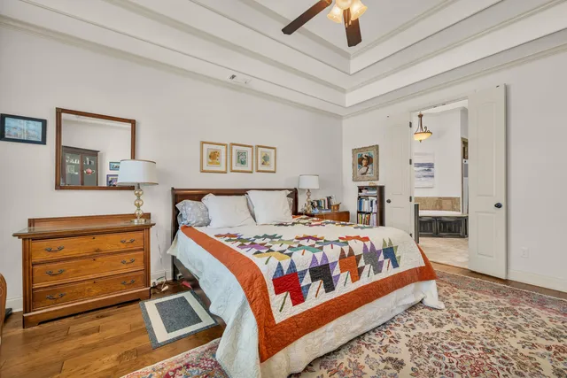 a bed room with a bed and a chandelier