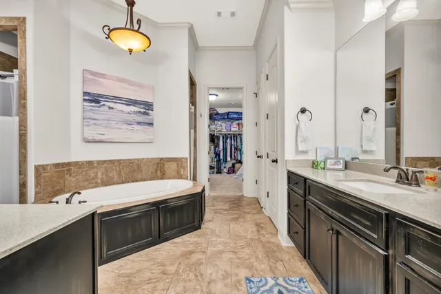a large kitchen with a sink and a stove top oven