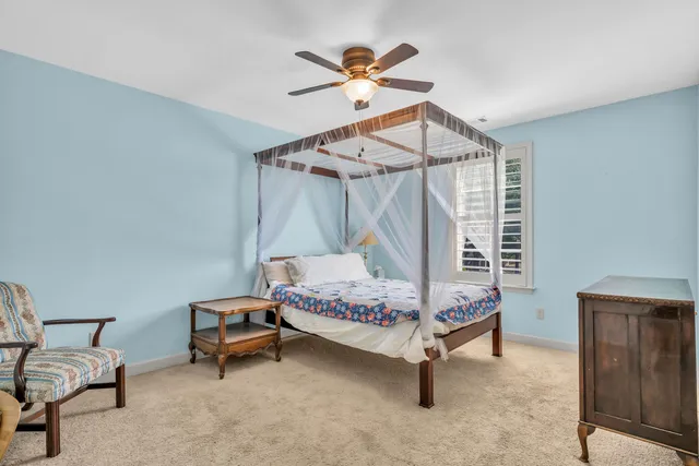 a bedroom with furniture and window