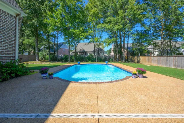 a view of a swimming pool with an outdoor space and seating area
