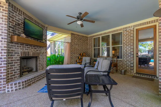 a view of a livingroom with furniture and a fireplace