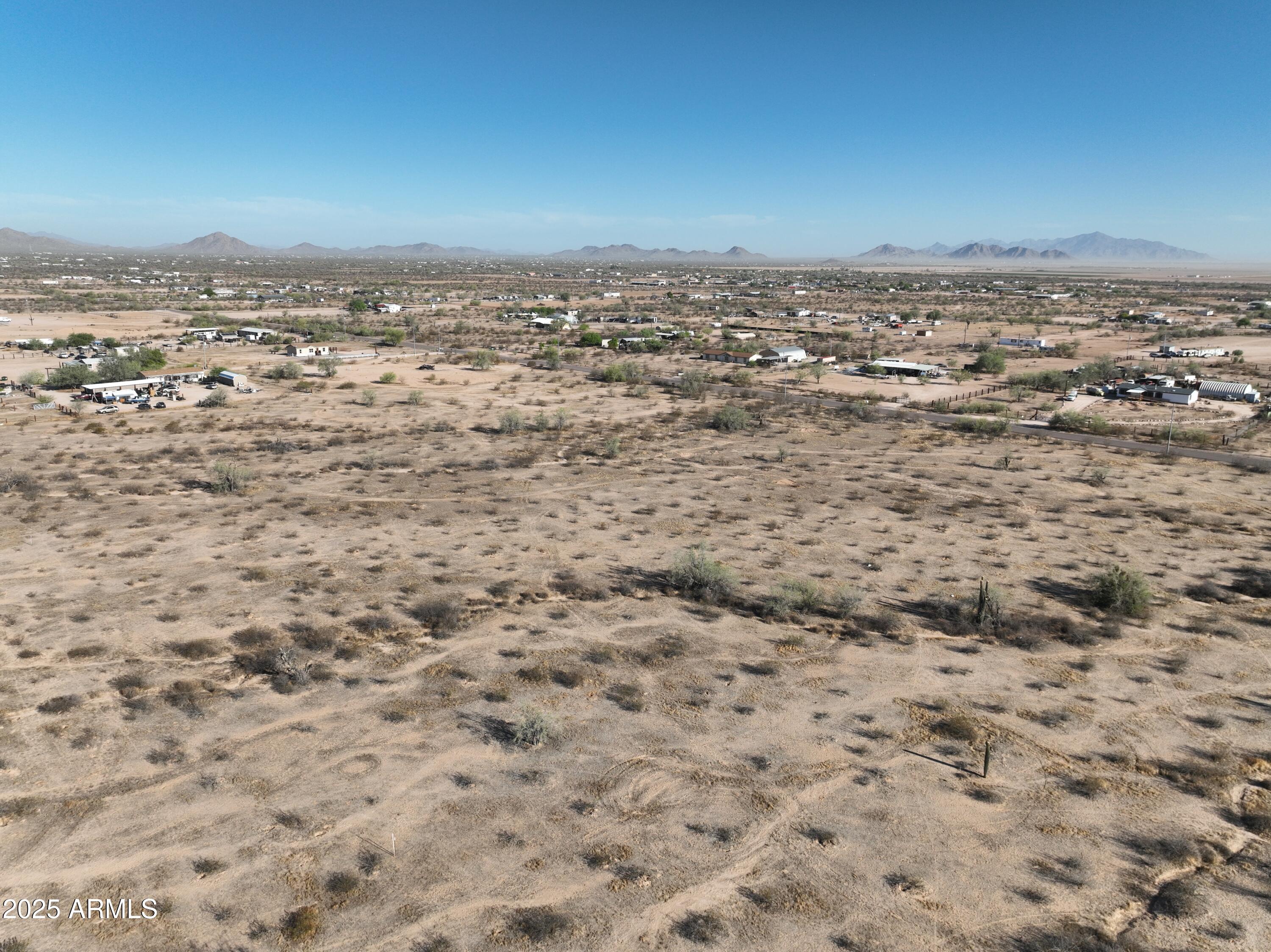 0 West Huisatch Road, Unit 191 Maricopa, AZ 85139 - Photo 6 of 20 an aerial view of residential houses with outdoor space
