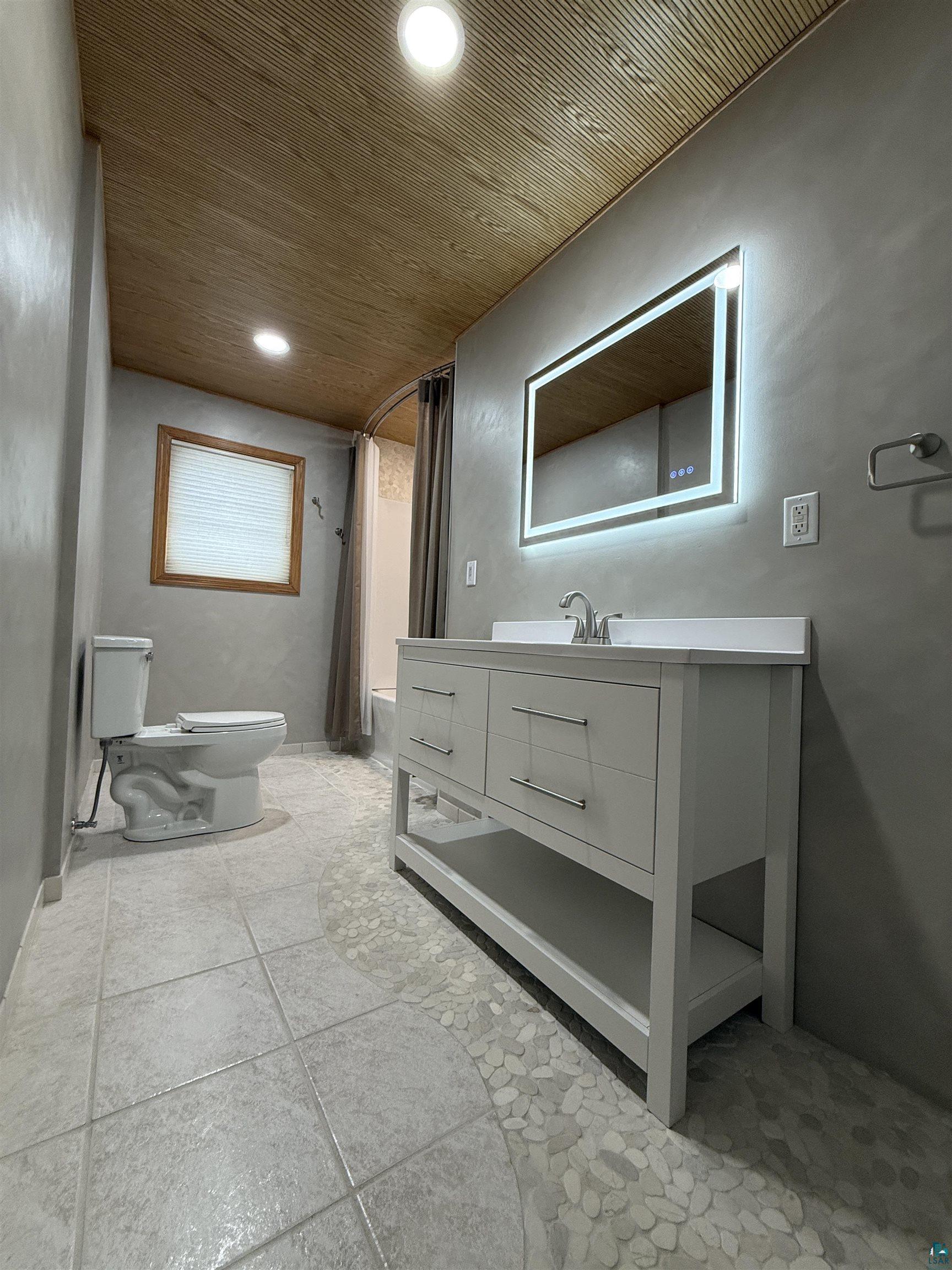 1321 South 13th Street Virginia, MN 55792 - Photo 12 of 33 Bathroom with vanity, shower / tub combo with curtain, and recessed lighting