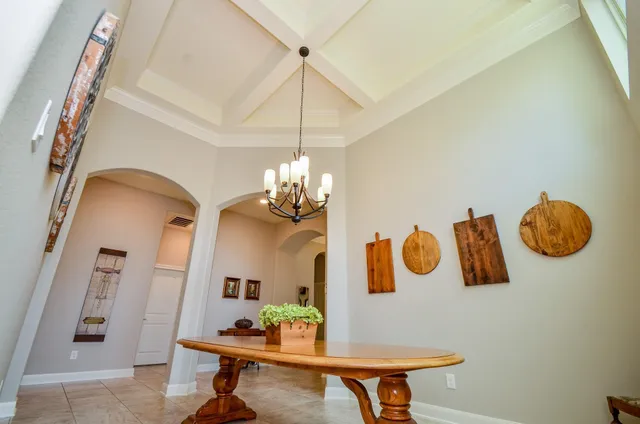 a table room with furniture and wooden floor