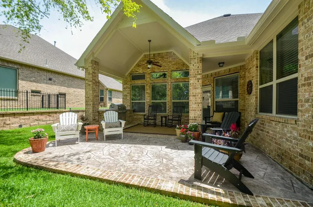 a front view of a house with outdoor seating
