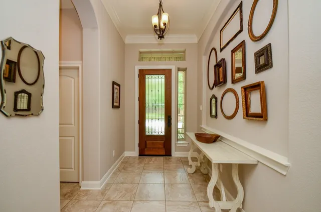 a front view of a house with entryway and windows