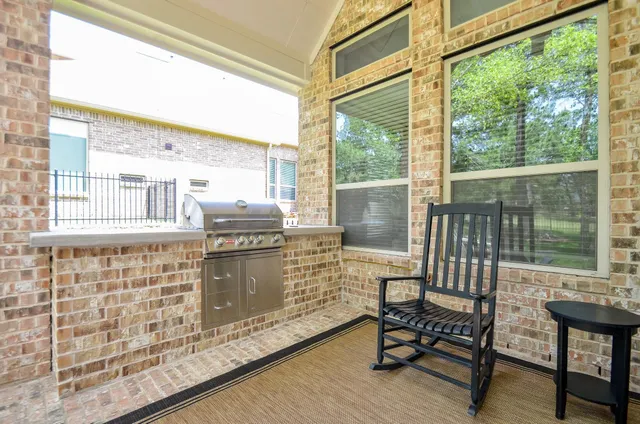 a view of a chairs and table in the balcony