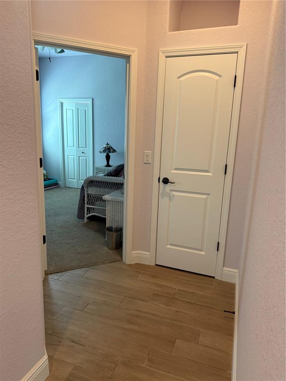 13110 Bamboo Street Spring Hill, FL 34609 - Photo 34 of 56 a view of a room that has a bed and a mirror