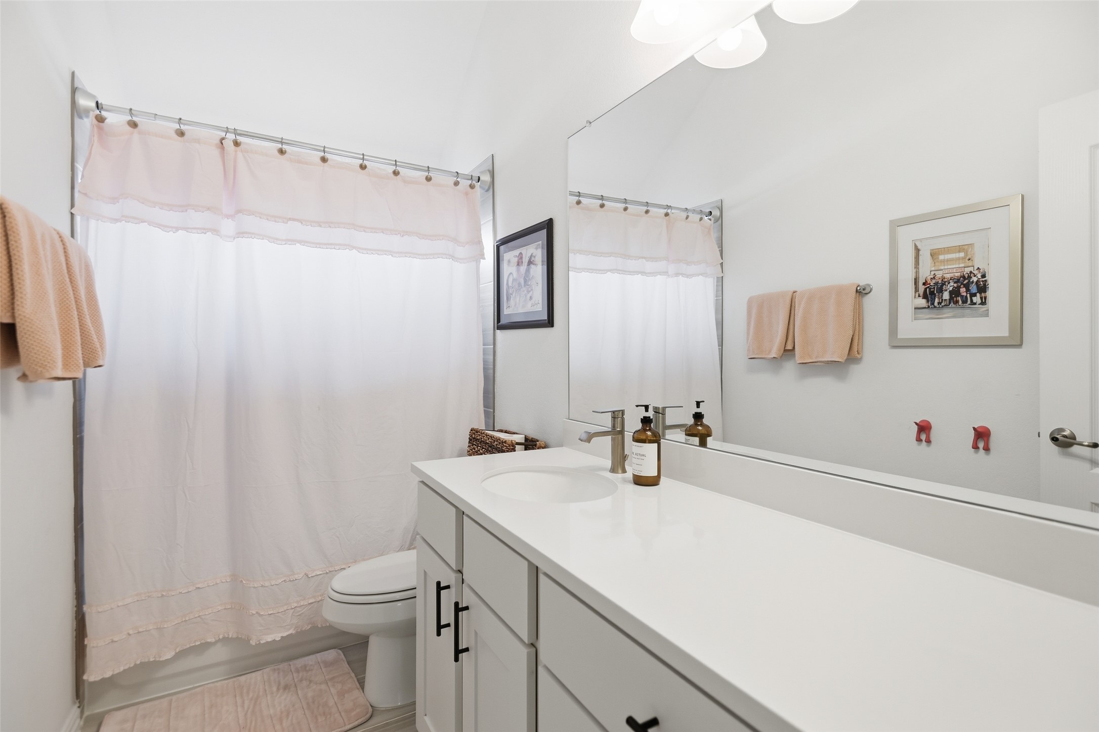 544 Cherrystone Loop Buda, TX 78610 - Photo 22 of 40 a bathroom with a sink a toilet and shower