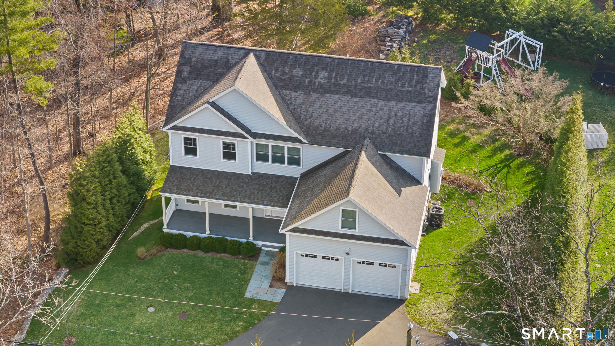 1049 Stillwater Road Stamford, CT 06902 - Photo 30 of 34 a aerial view of a house with a yard and potted plants
