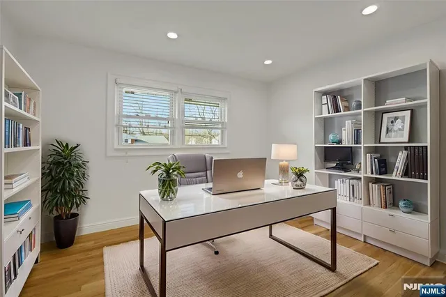 a workspace with furniture and a potted plant